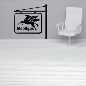 Black gas station wall decal with Mobligas sign and bird graphic