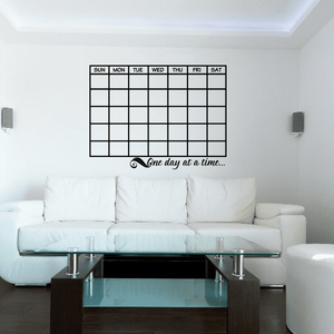 Monthly calendar wall decal with day grid and 'One day at a time' script text