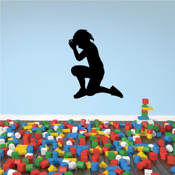 Prayer decal of a kneeling figure with open hands in prayer