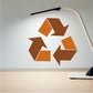 Recycle sticker with orange and brown arrows and geometric pieces