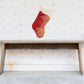 Red geometric origami-style Christmas stocking wall sticker