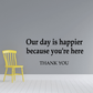 Yellow chair wall decal with quote: 'Our day is happier because you're here'.