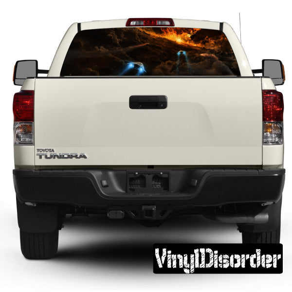 Rear window space-themed graphic decal on a white pickup truck