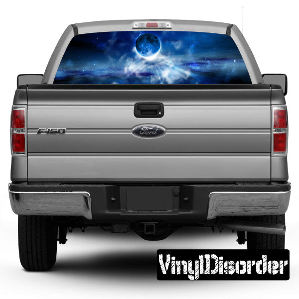 Pickup truck rear with blue space-themed rear window graphic and license plate frame