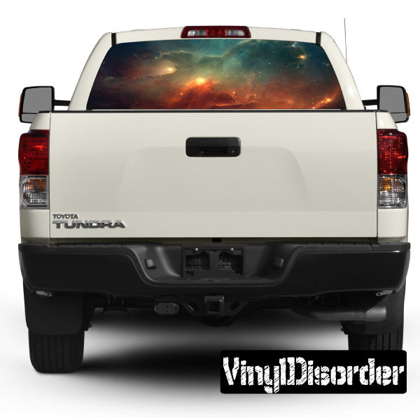Rear window graphic decal with outer space scene on pickup truck