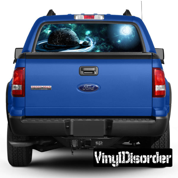 Blue pickup truck rear with outer space graphic on rear window
