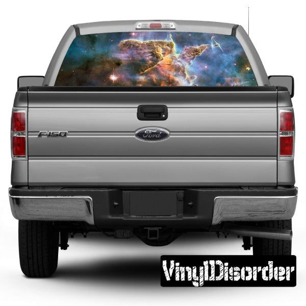 Outer space rear window graphic with colorful galaxy scene on vehicle glass