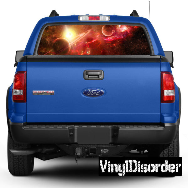Rear window graphic decal with outer space scene on blue pickup, Ford logo visible