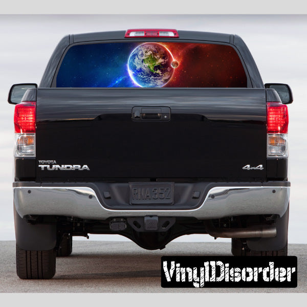 Rear window graphic decal with colorful outer space scene on pickup truck