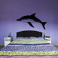 Swimming dolphin wall decal, dark silhouette in mid-jump