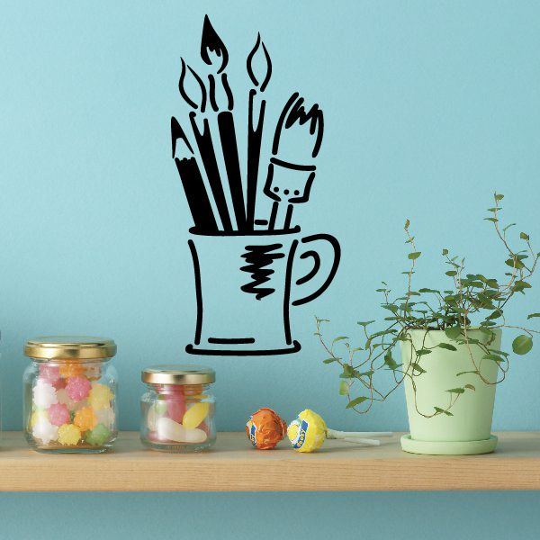 Paintbrushes in mug wall decal with black illustrated brush tips and splashes