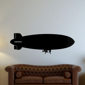 Black blimp airship decal, side view with windows and propeller.