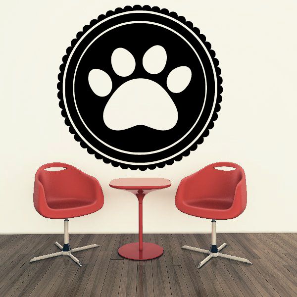 Black round paw print badge decal with white paw and scalloped border