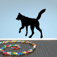 Pawing wolf silhouette decal, black standing with raised front paw and tail