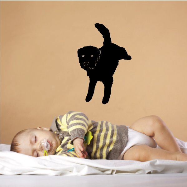 Black peeing puppy decal silhouette with raised tail
