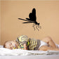 Black dragonfly wall decal with wings open and perched legs
