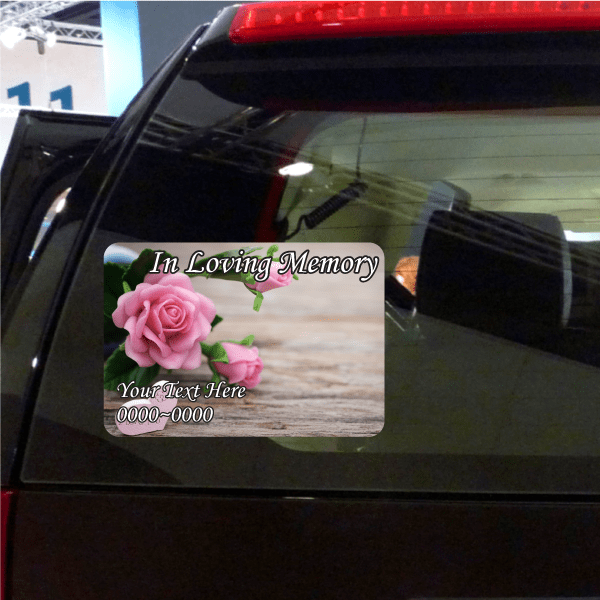 Memorial window sticker with pink roses and text "In Loving Memory"