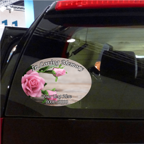 Oval memorial sticker: pink rose, green leaves, "In Loving Memory" and "Your Text Here"