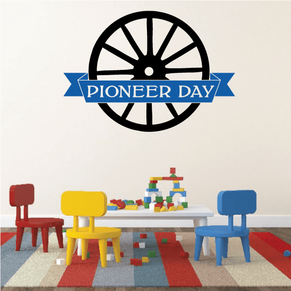 Pioneer Day wall decal with black wagon-wheel graphic and blue ribbon banner