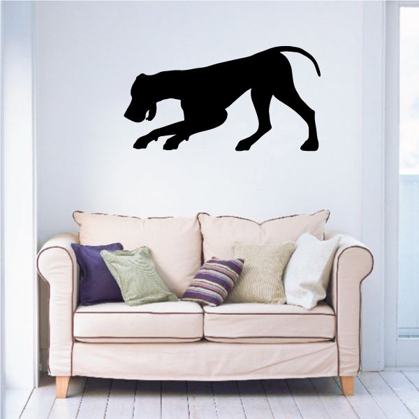 Playing Great Dane wall decal, black dog silhouette above a sofa