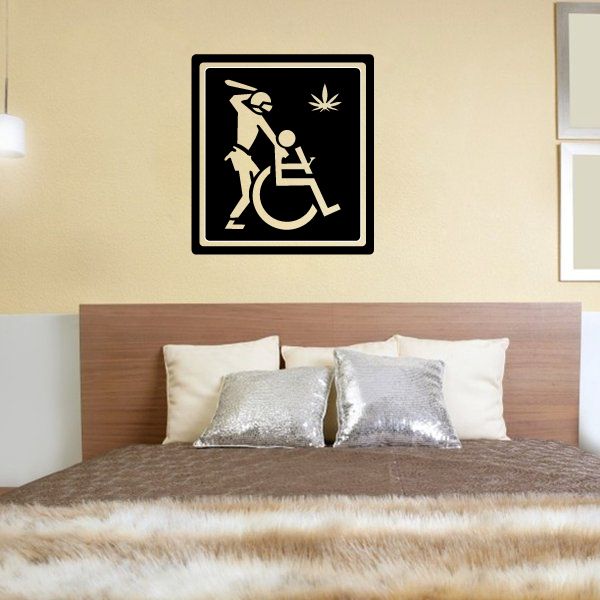Black square accessibility decal with raised fist and wheelchair icon