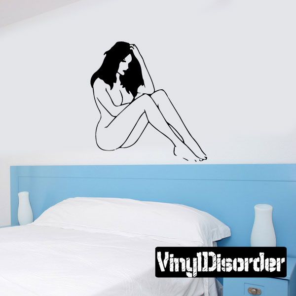 Seated woman wall decal with black outline, legs crossed and hands on head