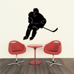 Hockey player decal, black silhouette leaning forward with stick