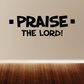 Wall decal with bold black text: “PRAISE THE LORD!”