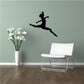 Black dancer silhouette wall decal, jumping with one leg extended