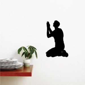 Praying brother wall decal with black kneeling silhouette and hands together