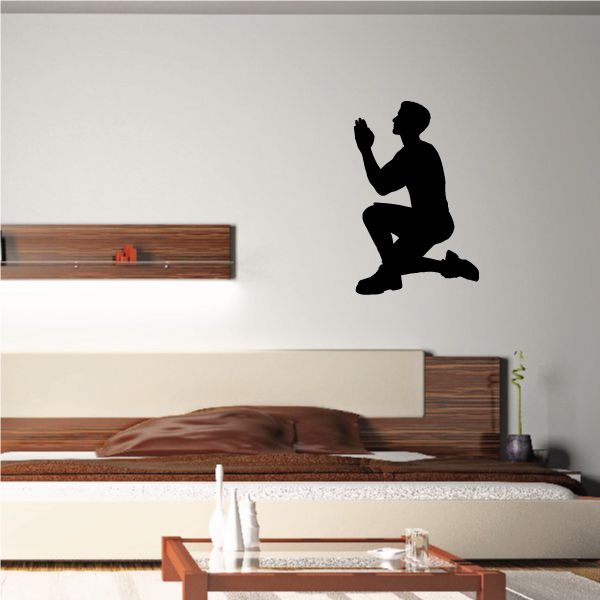 Praying father on one knee decal, dark silhouette with raised hands and kneeling pose