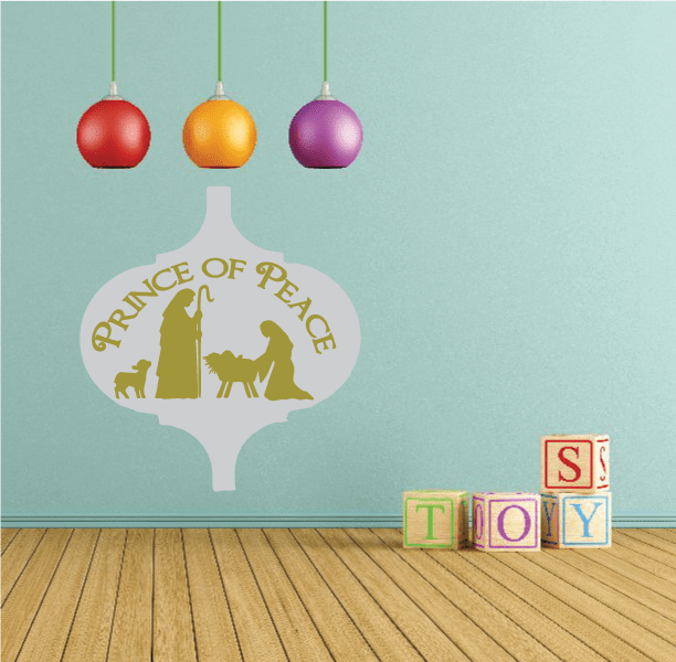 Christmas vinyl wall decal in tree shape with gold nativity scene and “Prince of Peace” text