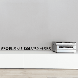 Wall quote decal reading 'PROBLEMS SOLVED HERE'