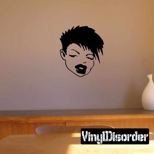 Stylized face decal with short spiky black hair and closed eyes, dark features