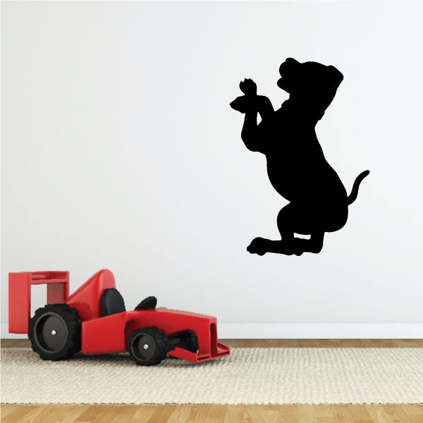Black puppy beg silhouette wall decal with raised paws