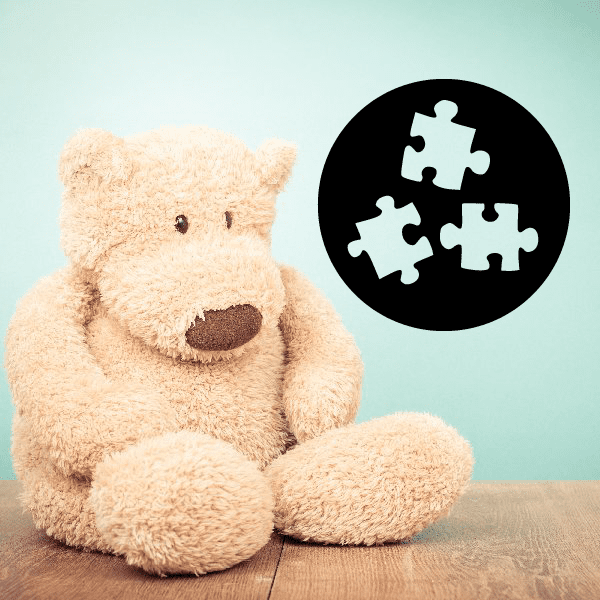 Puzzle-piece vinyl wall decal sticker, round black with white jigsaw pieces