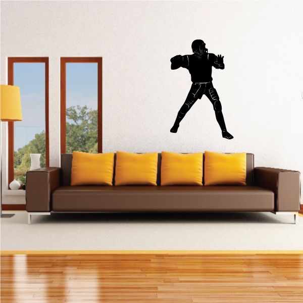 Quarterback vinyl wall decal of black player silhouette in throwing pose