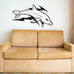 Dolphin and wave swimming decal, black outline with white fill