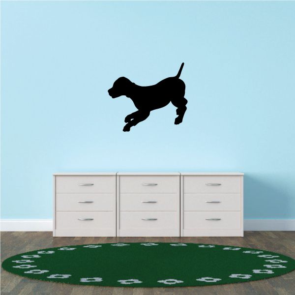 Black puppy silhouette decal with standing tail and playful pose
