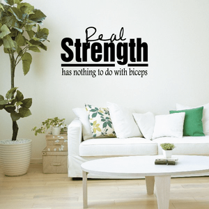 Inspirational wall decal: “Strength has nothing to do with biceps”