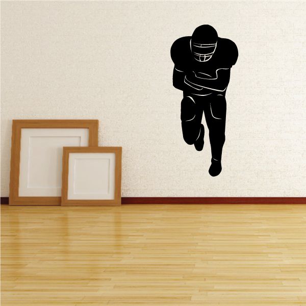 Football runningback wall decal, black player silhouette running with ball
