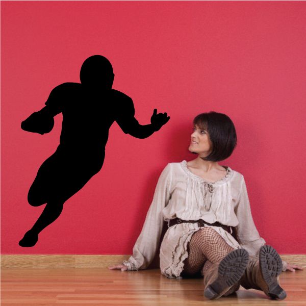 Running football player wall decal, black silhouette of a sprinting figure
