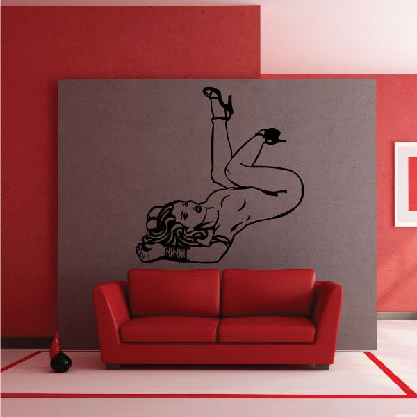 Reclining nude woman in heels decal, black line-art figure on gray surface