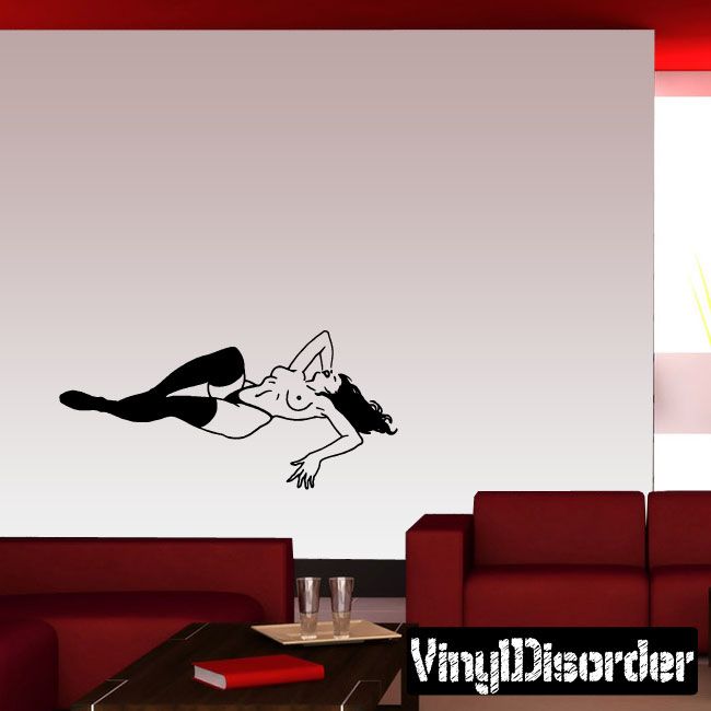 Vinyl wall decal: reclining topless woman in black stockings, arms extended