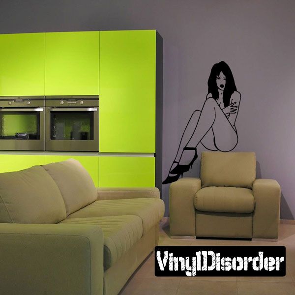 Reclining woman in heels vinyl decal, black outline figure with legs crossed and high heels