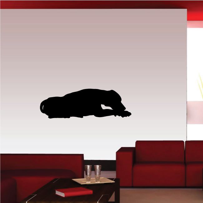 Resting hound decal featuring a black dog silhouette lying down