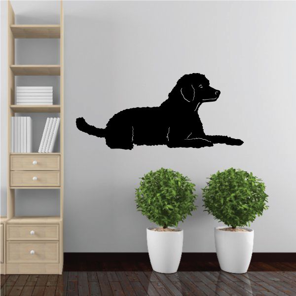 Resting poodle decal with black sitting dog silhouette in profile