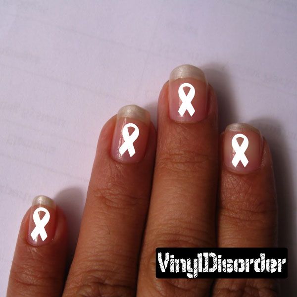 Vinyl fingernail art stickers with white ribbon emblems on nude nails