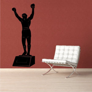 Black Rocky Balboa boxing figure decal with arms raised on a pedestal