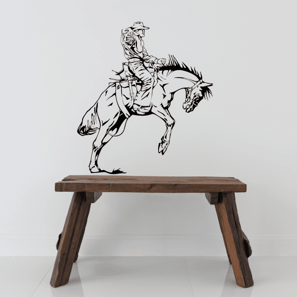 Wall decoration of a cowboy in action riding a horse